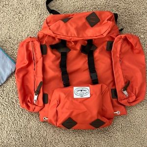 Orange Poler backpack.